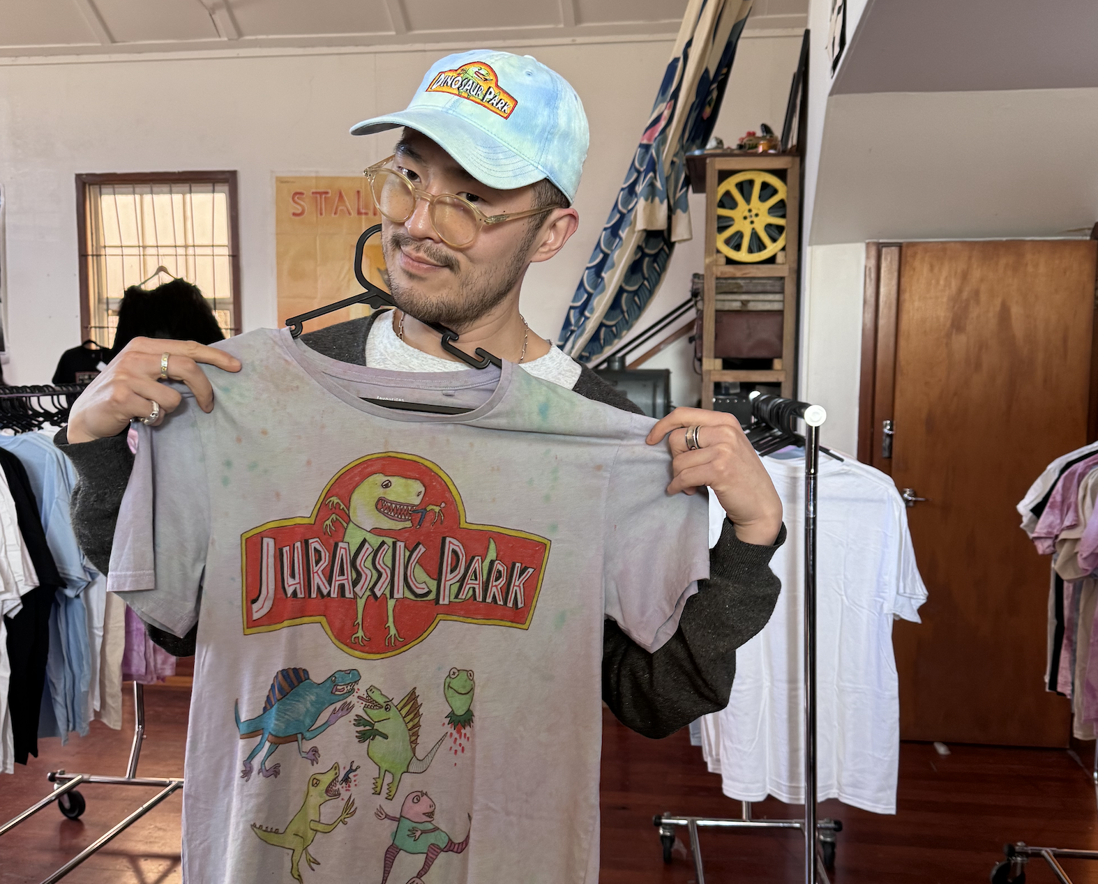 A reader with a tie dye shirt