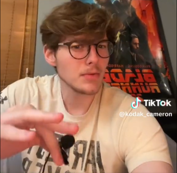 TikToker gripping a lapel mic