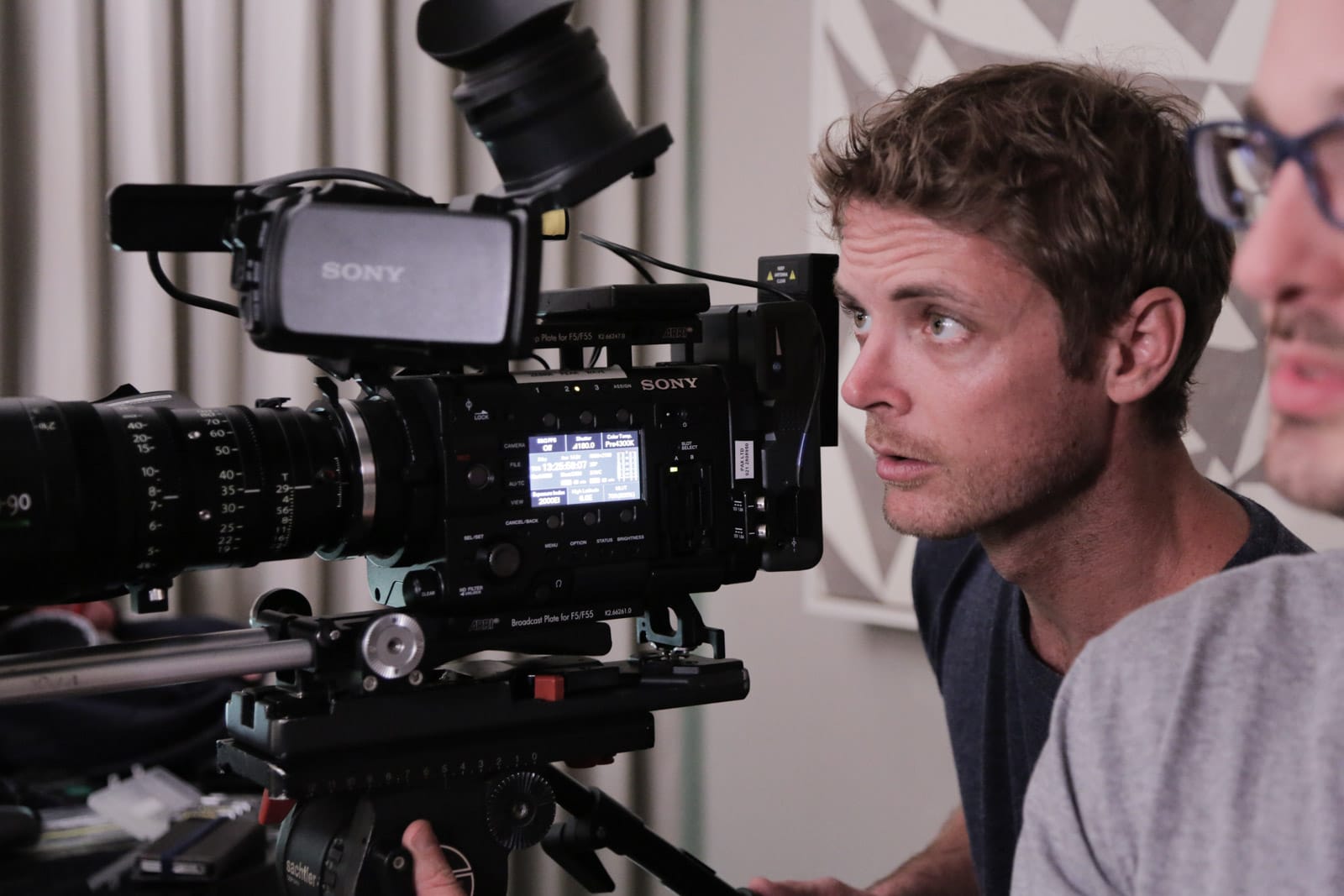 Dom behind the camera during an interview