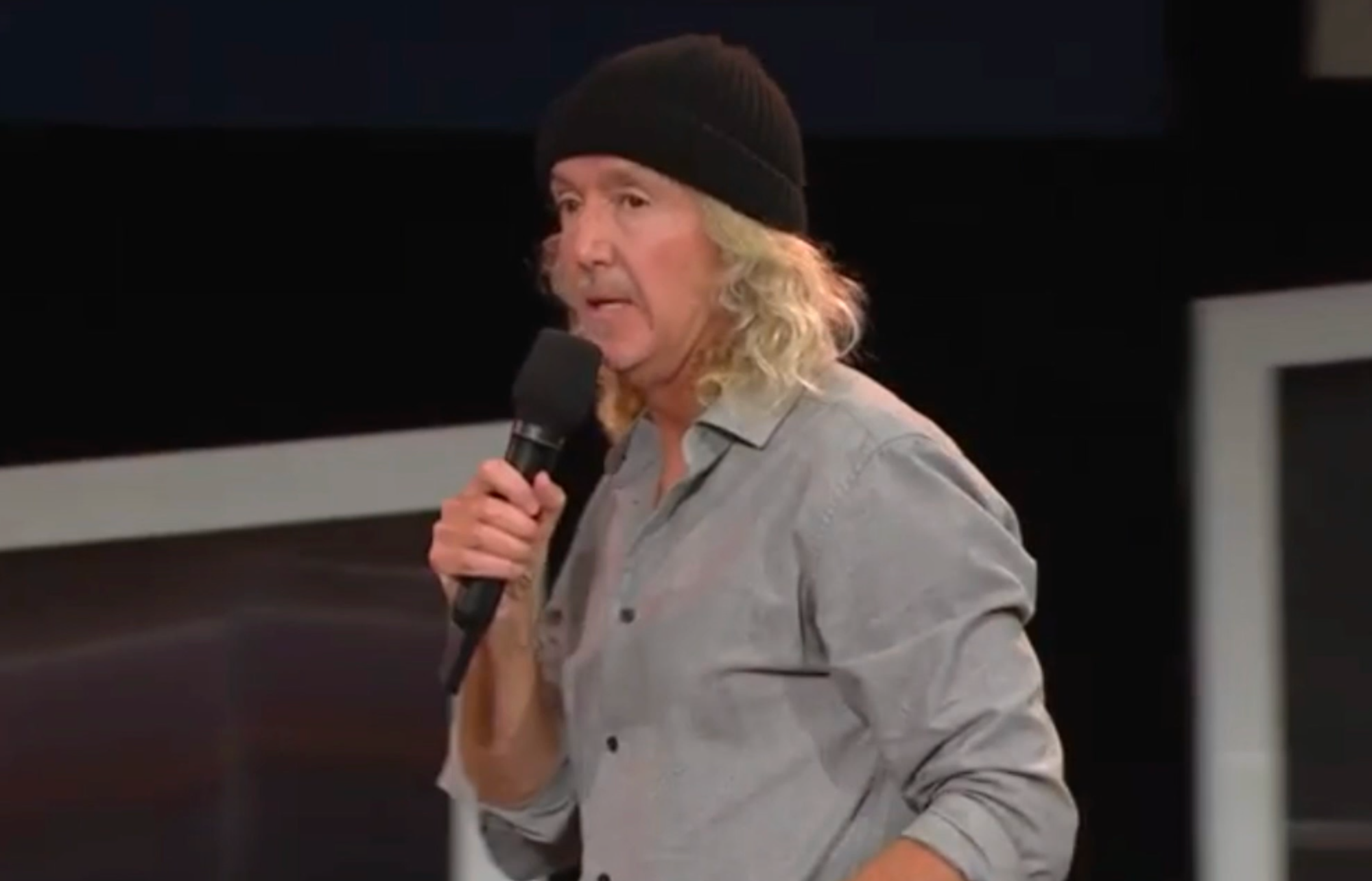 Australian Weird Al with his black beanie and long hair