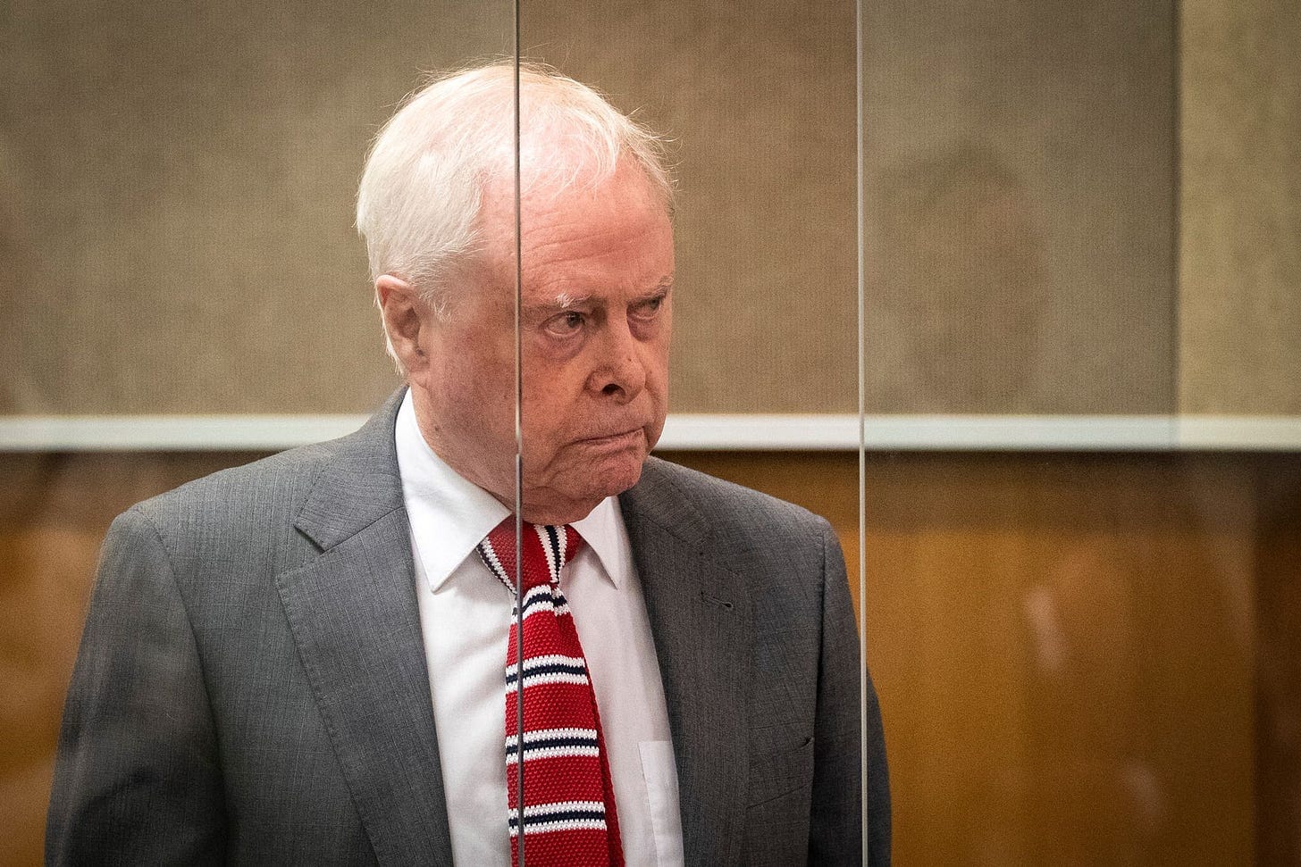 Sir James Wallace glowering away in court