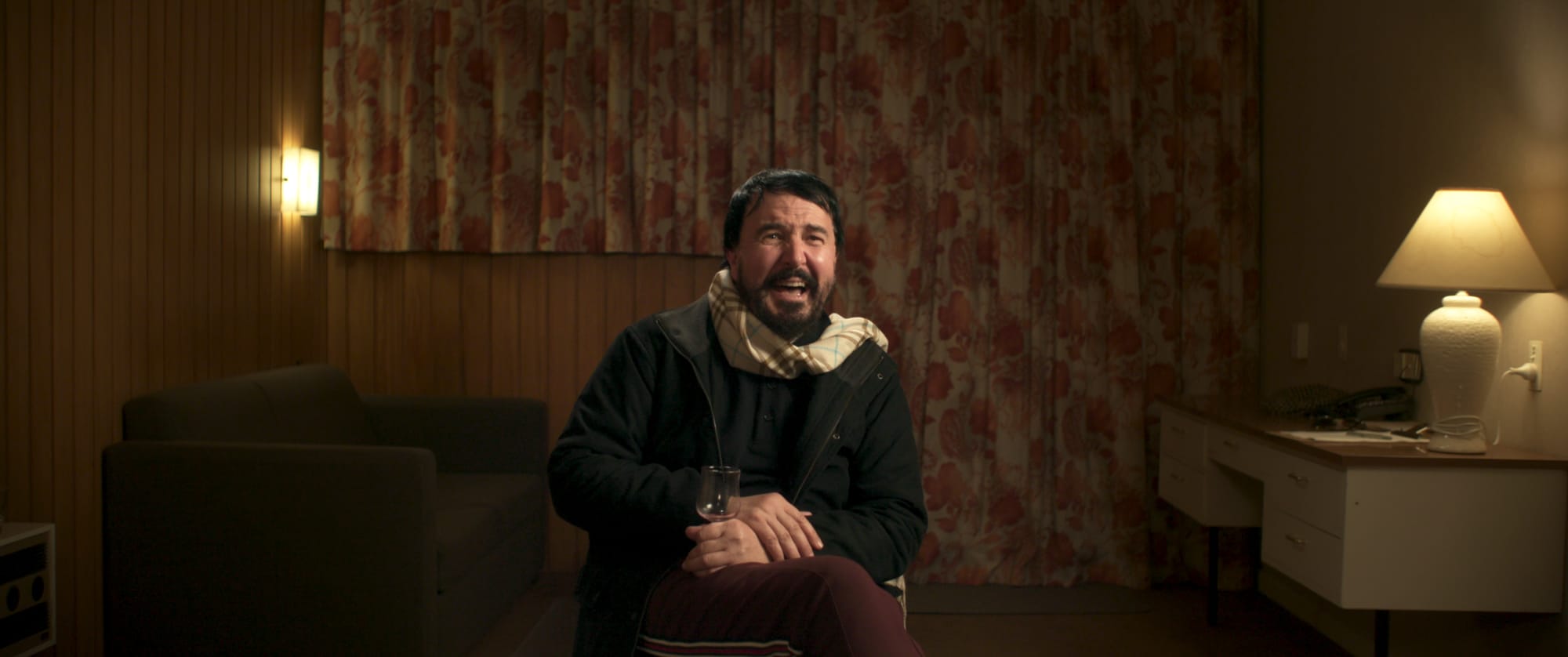 Mister Organ laughing in hotel room