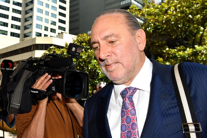 Brian Houston heading into court