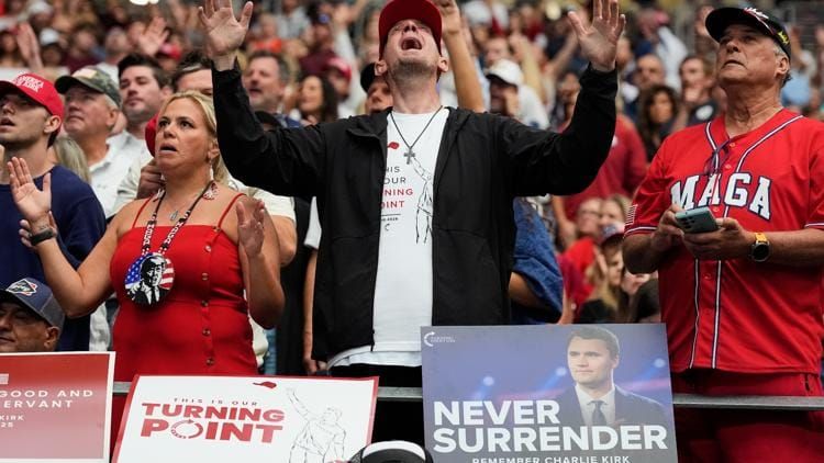 Praying at Kirk's funeral