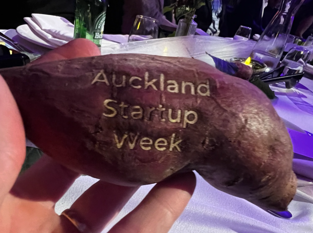 A kumara with laser writing on it