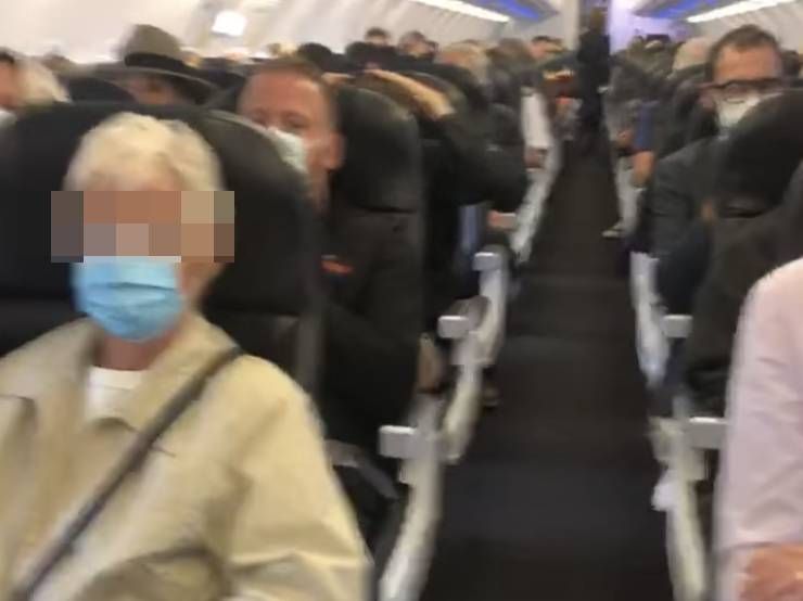 Taking flight: the QAnon crowd avoiding masks