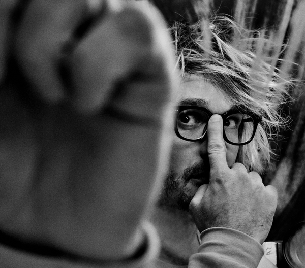 Me pushing my glasses up my face like a real nerd