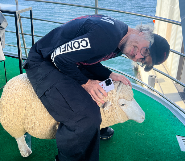Me on a sheep on a boat.