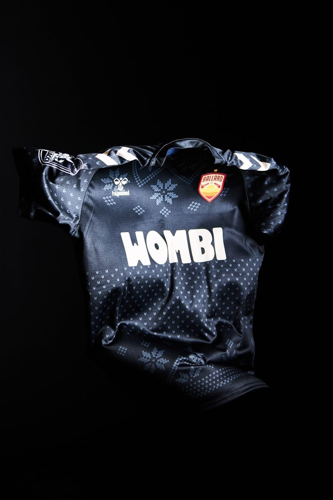 A dark blue Ballard FC goalkeeper jersey with Nordic sweater details.