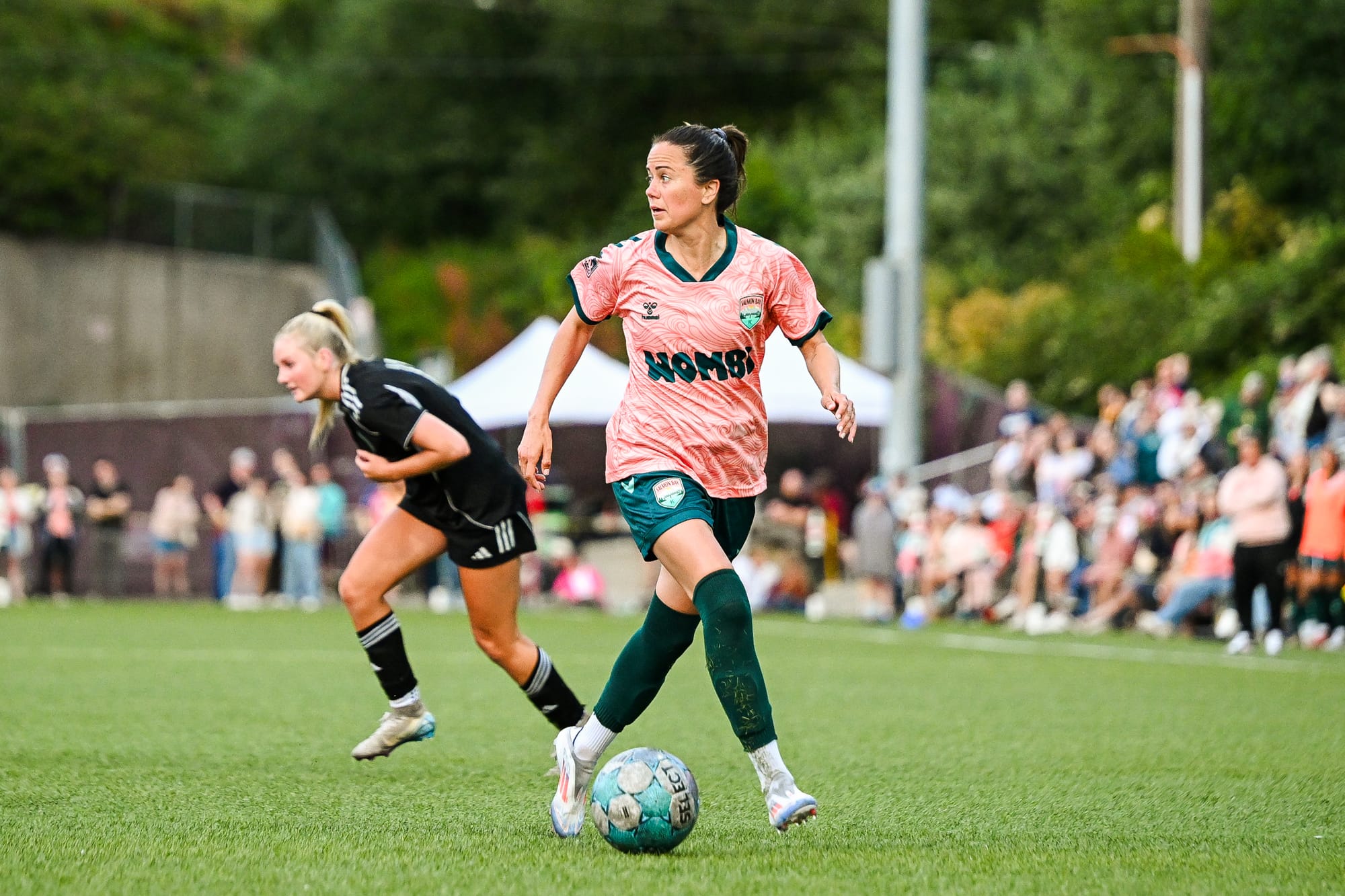 Former Seattle Reign player and curent co-owner of Salmon Bay, Lu Barnes, dribbles the ball in second half action