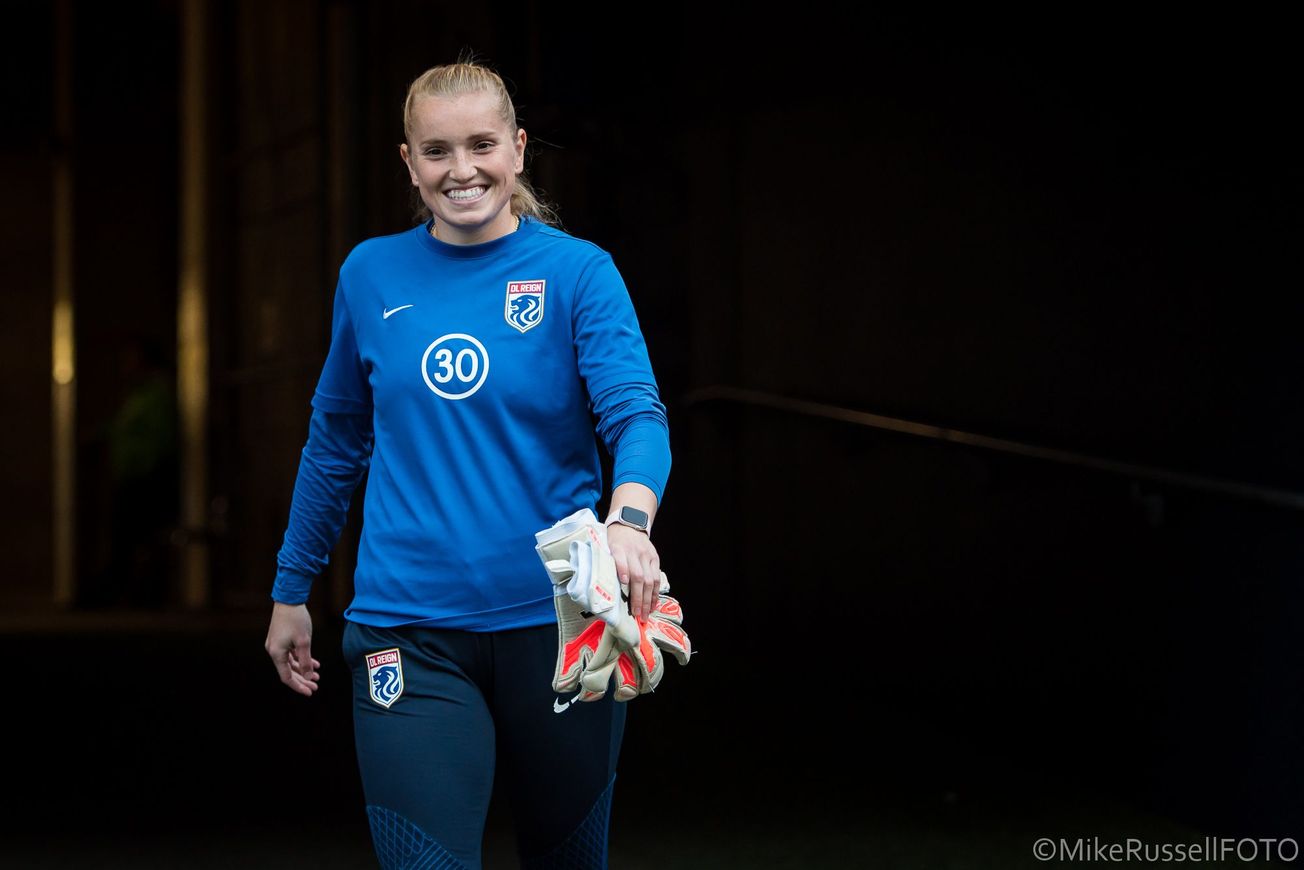 OL Reign goalkeeper Claudia Dickey emerging from the stadium tunnel ahead of a match.