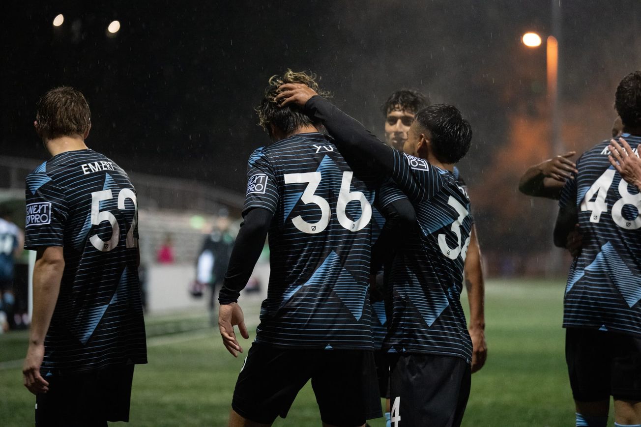 Yu Tsukanome celebrates the win with his teammates.