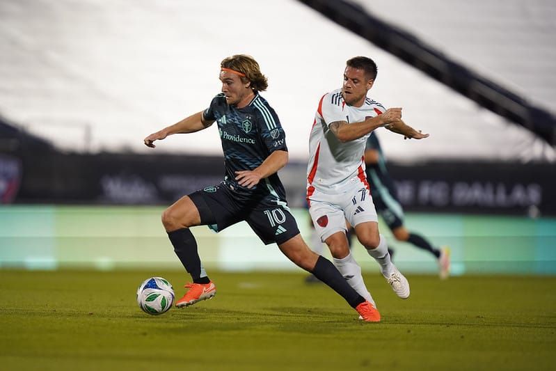 Pedro de la Vega dribbles past a Dallas defender in a April 2025 game