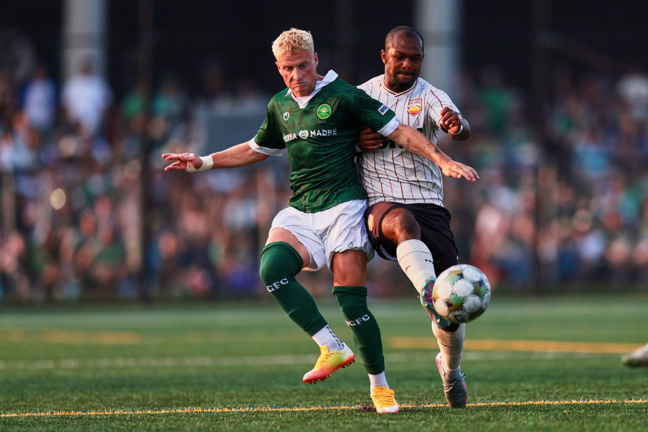 Ballard's Khai Brisco battles Vermont's Ian Abbey in the USL National Championship.