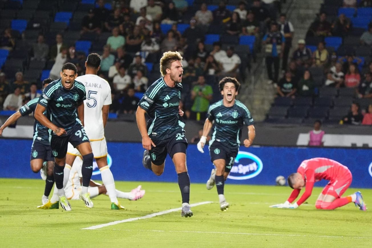 Pedro de la Vega, Osaze De Rosario and Paul Rothrock celebrate a goal as the Galaxy suff