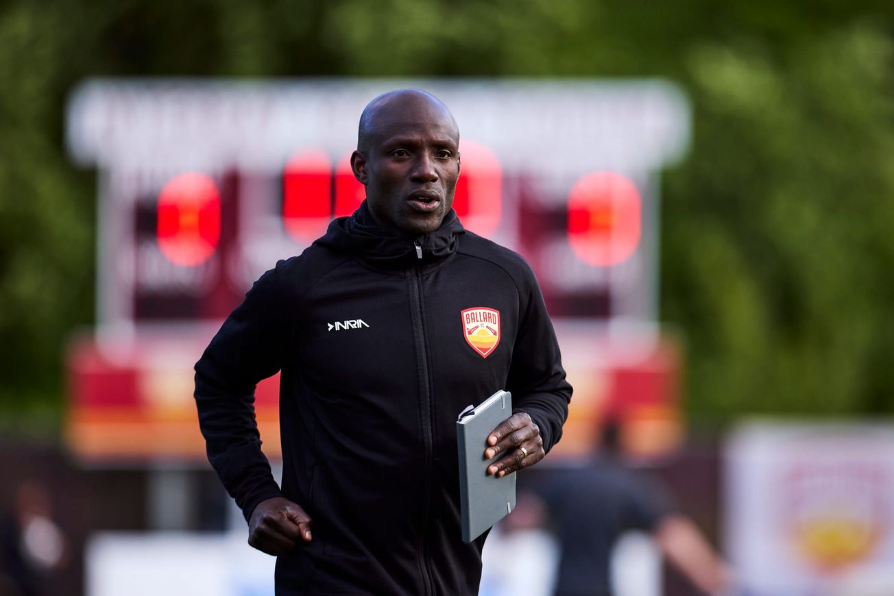 New Ballard FC Head Coach Mutanda Kwesele on the field at a 2025 match against Bigfoot FC