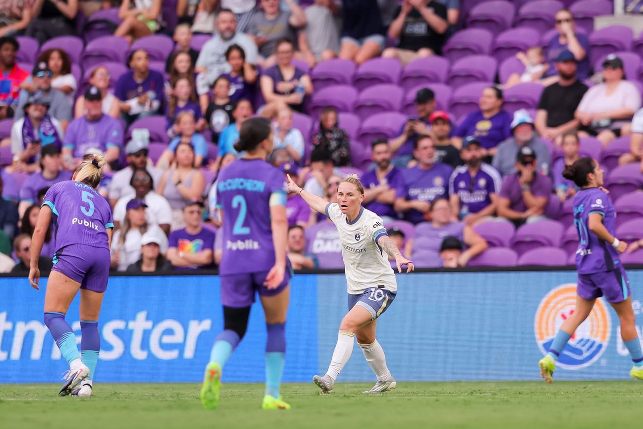 Reign midfielder Jess Fishlock celebrates her first-half goal against the Orlando Pride in March 2026.