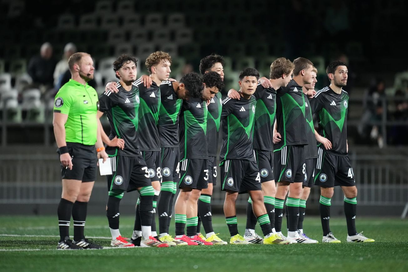 Tacoma Defiance players stand at the midfield line wearing black uniforms during a shootout