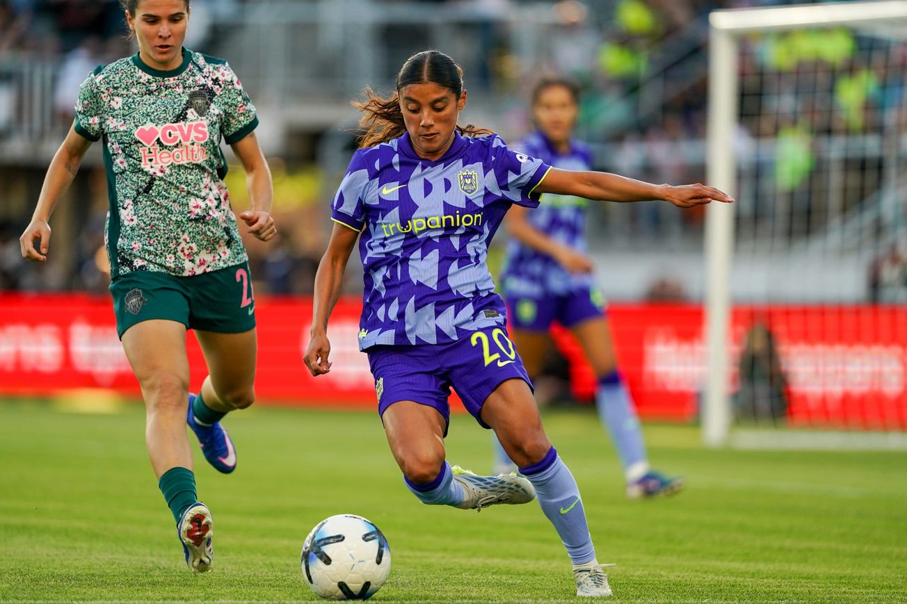Sam Meza dribbles against a Washington Spirit defender in the second half of a May 2026 match at Audi Field.