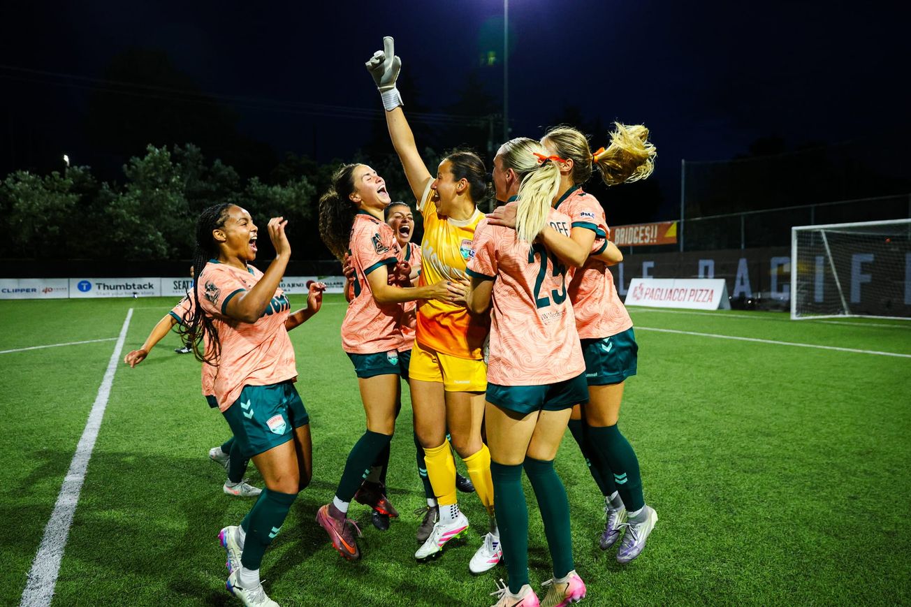 Salmon Bay FC players celebrate their first every playoff victory.