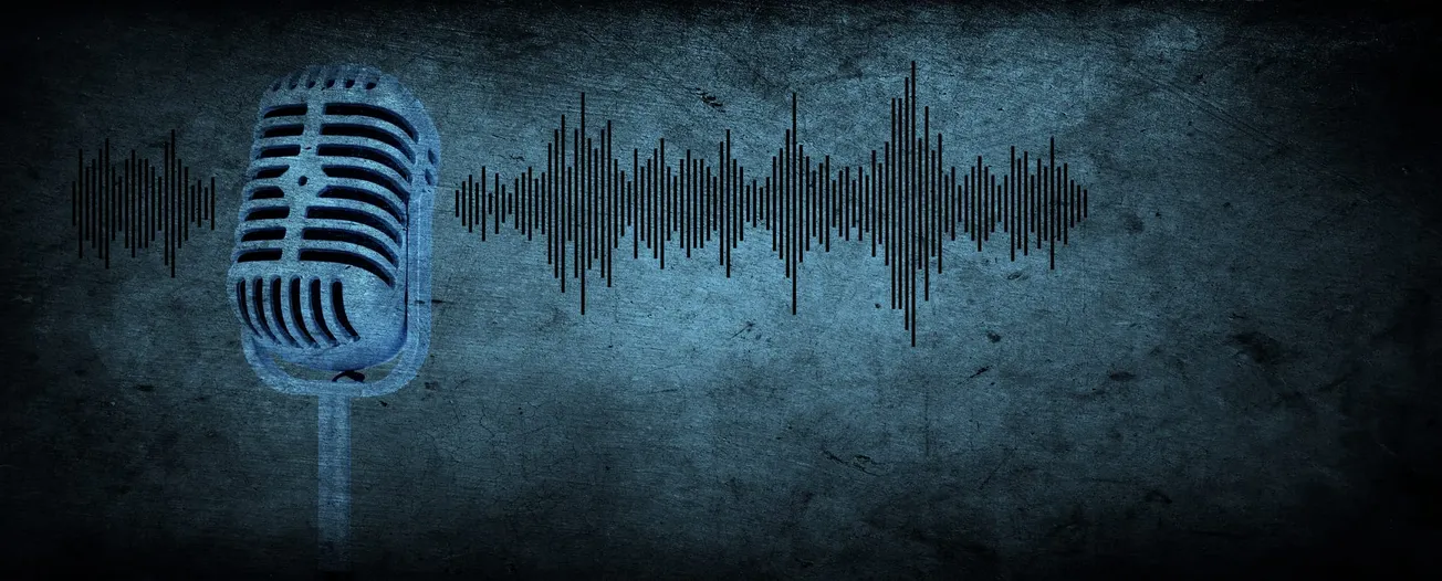 Vintage microphone with audio waveform on textured blue background. 