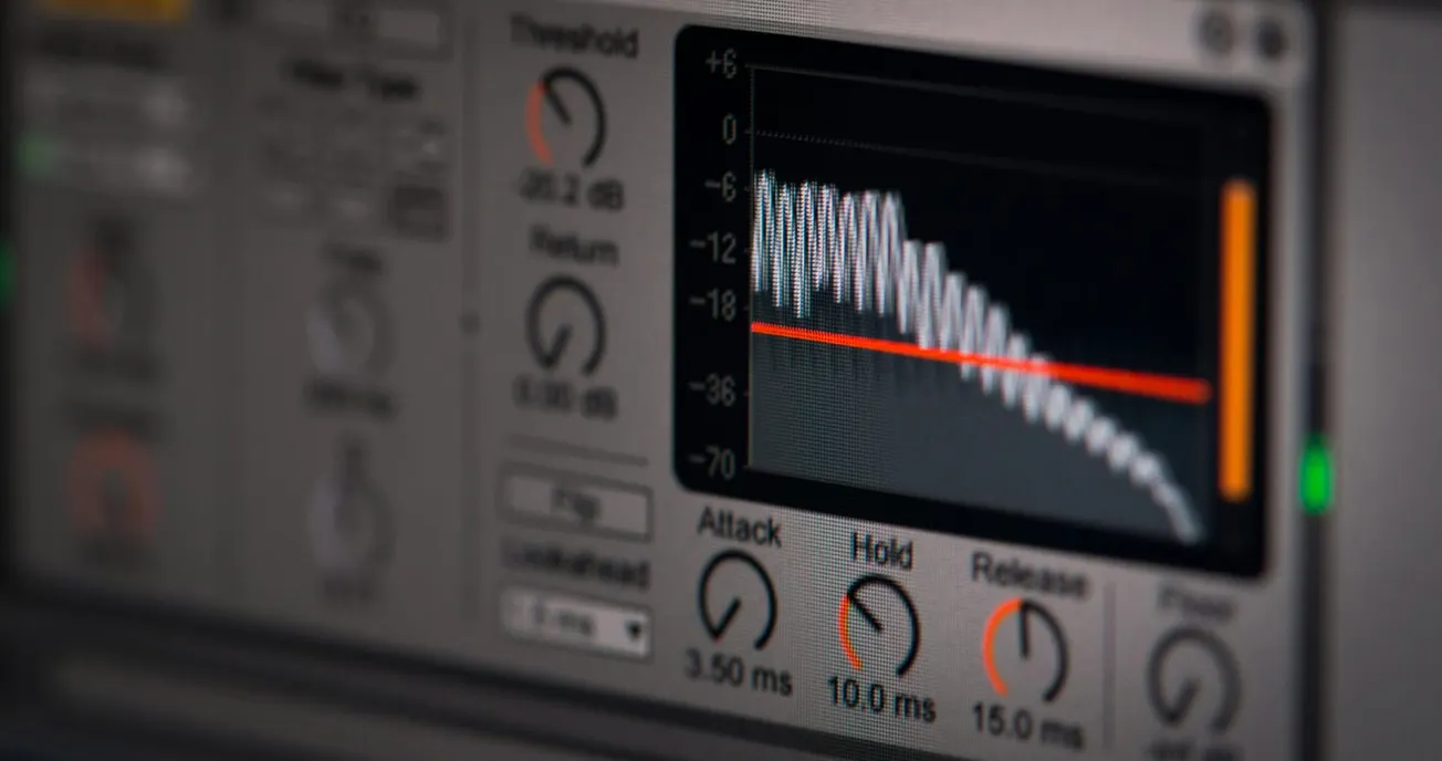 Close-up of an audio mixing software interface showing a graph with sound waveforms and adjustment knobs. 