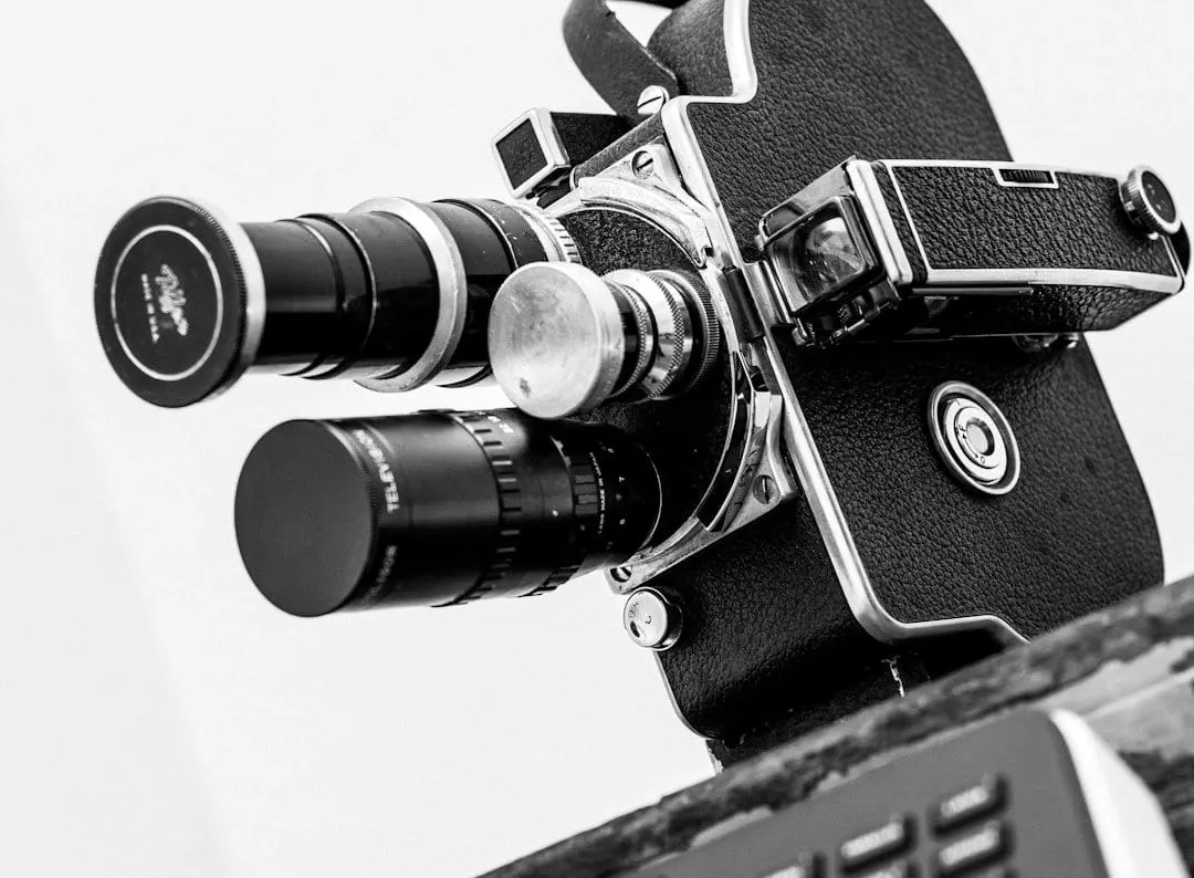 A split image contrasting a vintage film camera and analog audio recorder with a modern digital mirrorless camera and portable audio interface.