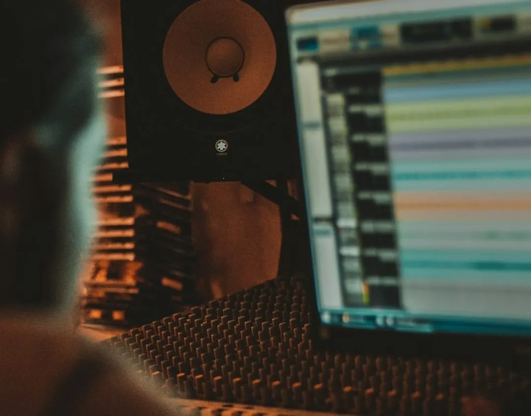A professional audio engineer meticulously adjusts controls on a digital audio workstation screen, showcasing intricate sound design for a podcast or video production.