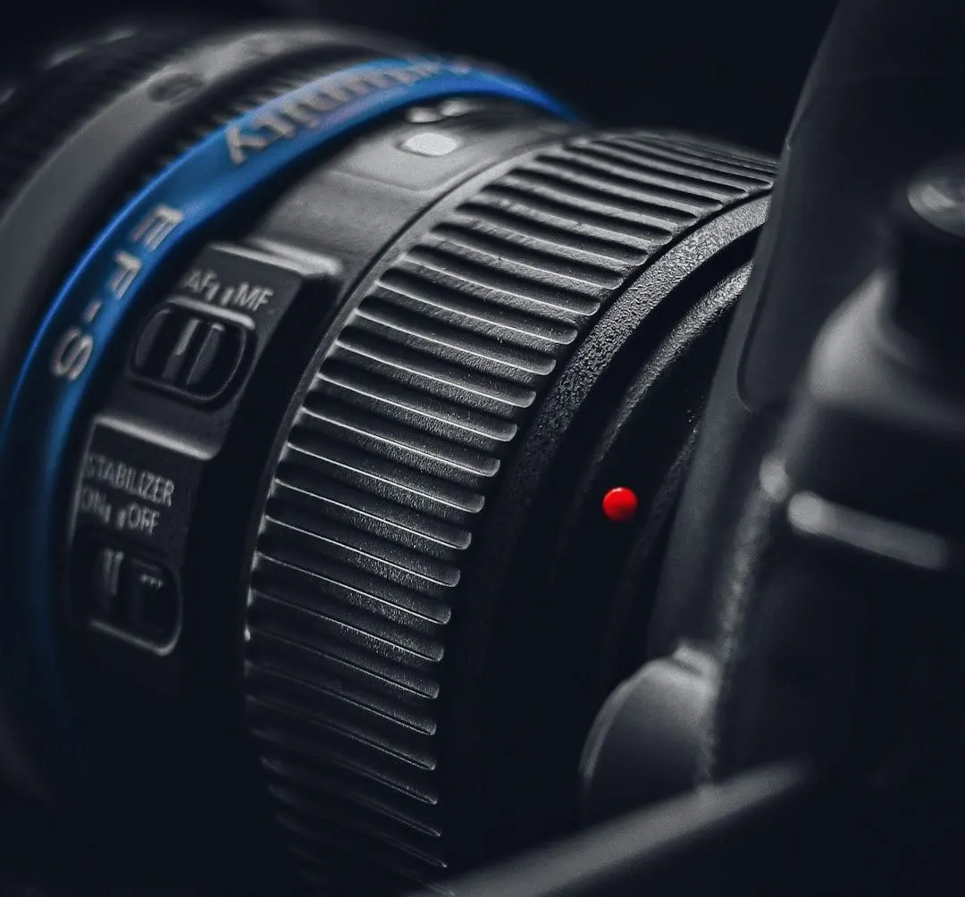 A premium camera lens with "Made in Vietnam" clearly displayed, symbolizing global shifts in video production equipment manufacturing.