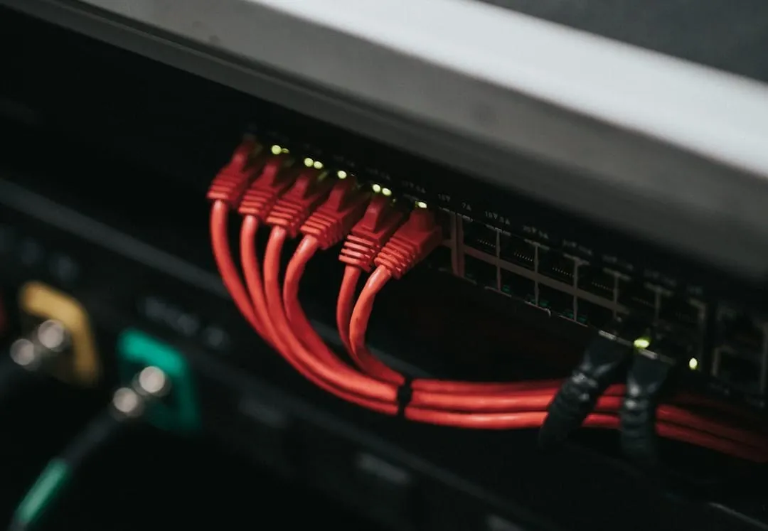 A compact Cat6 ethernet cable dramatically reduces clutter compared to multiple thick, conventional XLR audio multicore snakes on a stage.
