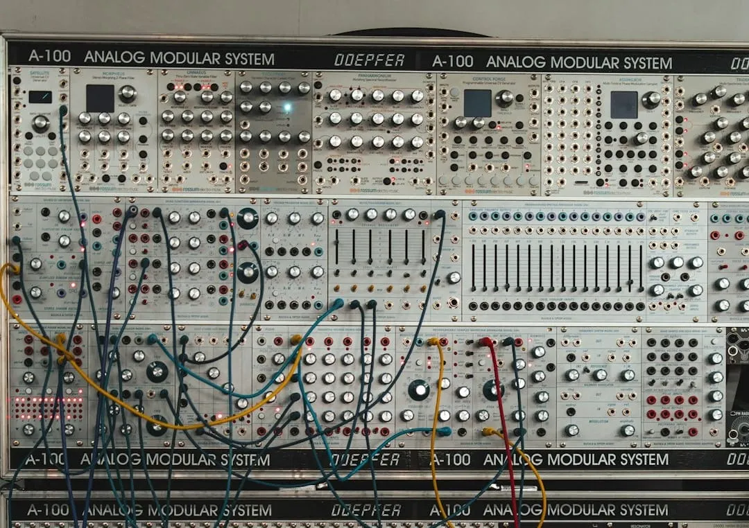 A detailed close-up shows complex electronic components on a circuit board, illustrating the intricate nature of modern audio and video production equipment.