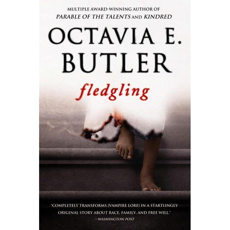 Book cover for Fledgling. The top half is white and fades into the feet of a Black girl descending some stairs. She appears to be wearing a white dress smoldering at the edges.