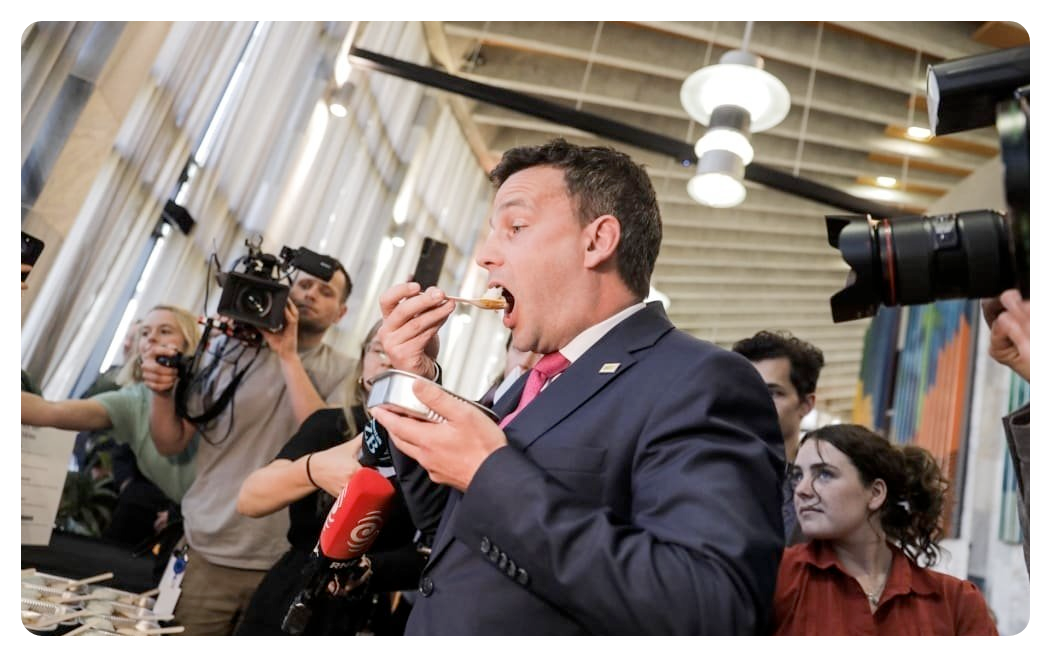 A picture of David Seymour eating a specially-prepared school lunch at a media standup. Photo: Otago Daily Times