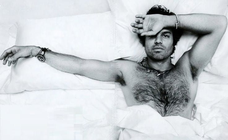 Helen Mirren lights Stanley Tucci's cigar and winks...