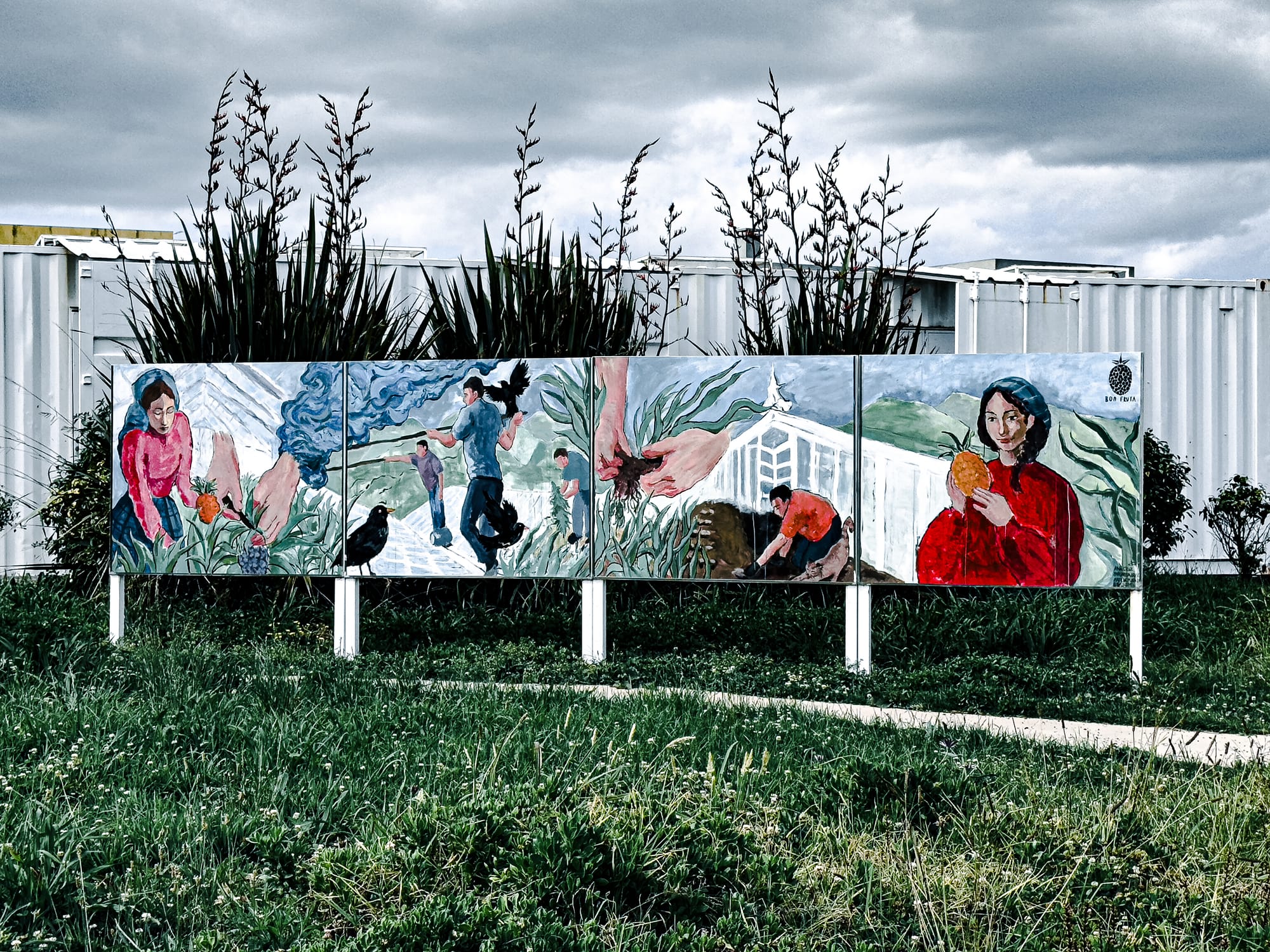 Painted mural at the plantation depicting pineapple workers and island life