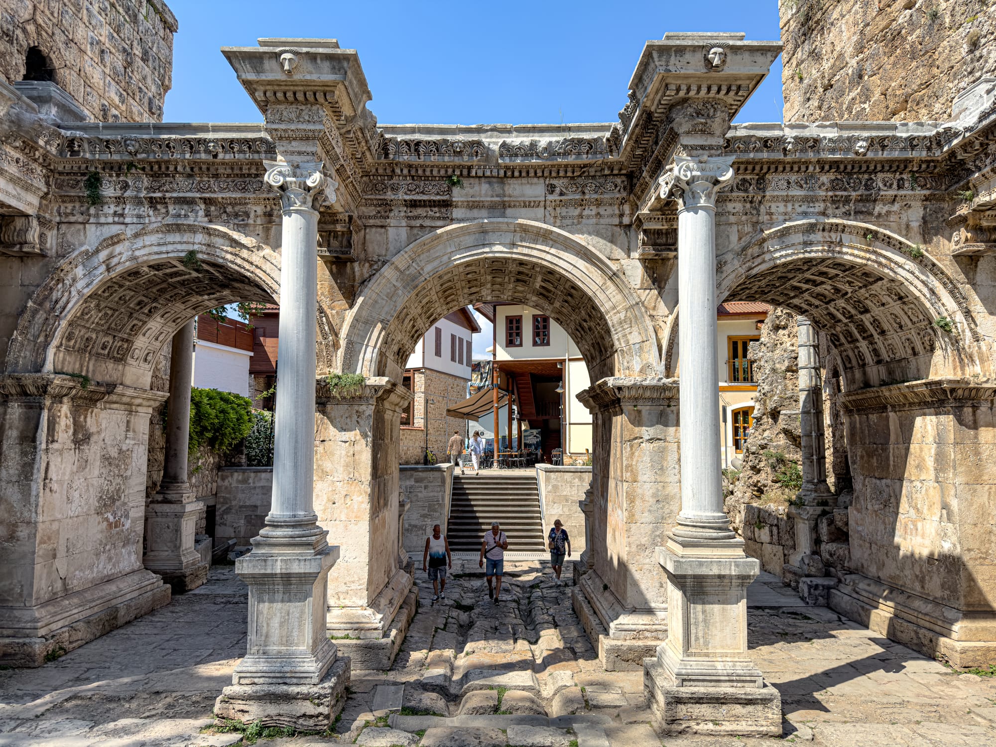 Hadrian’s Gate in Antalya, an ornate Roman-era triumphal arch with three barrel-vaulted passages and towering marble columns