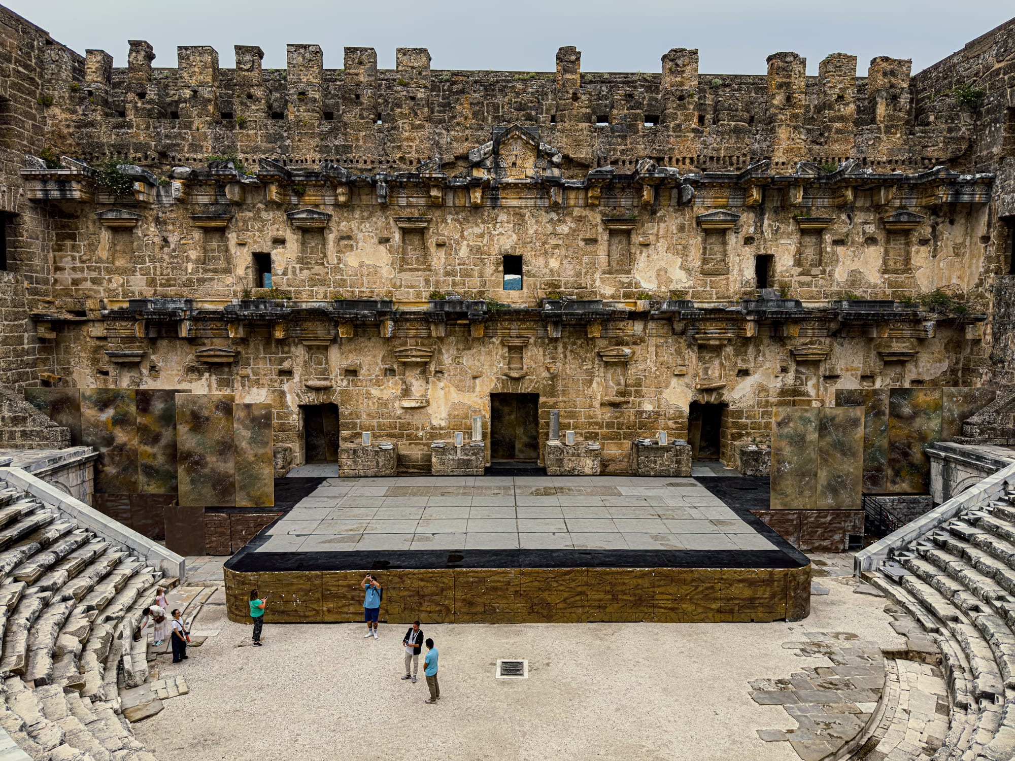 A well-preserved Roman theater in Aspendos, featuring an ornate stage wall and modern performance platform