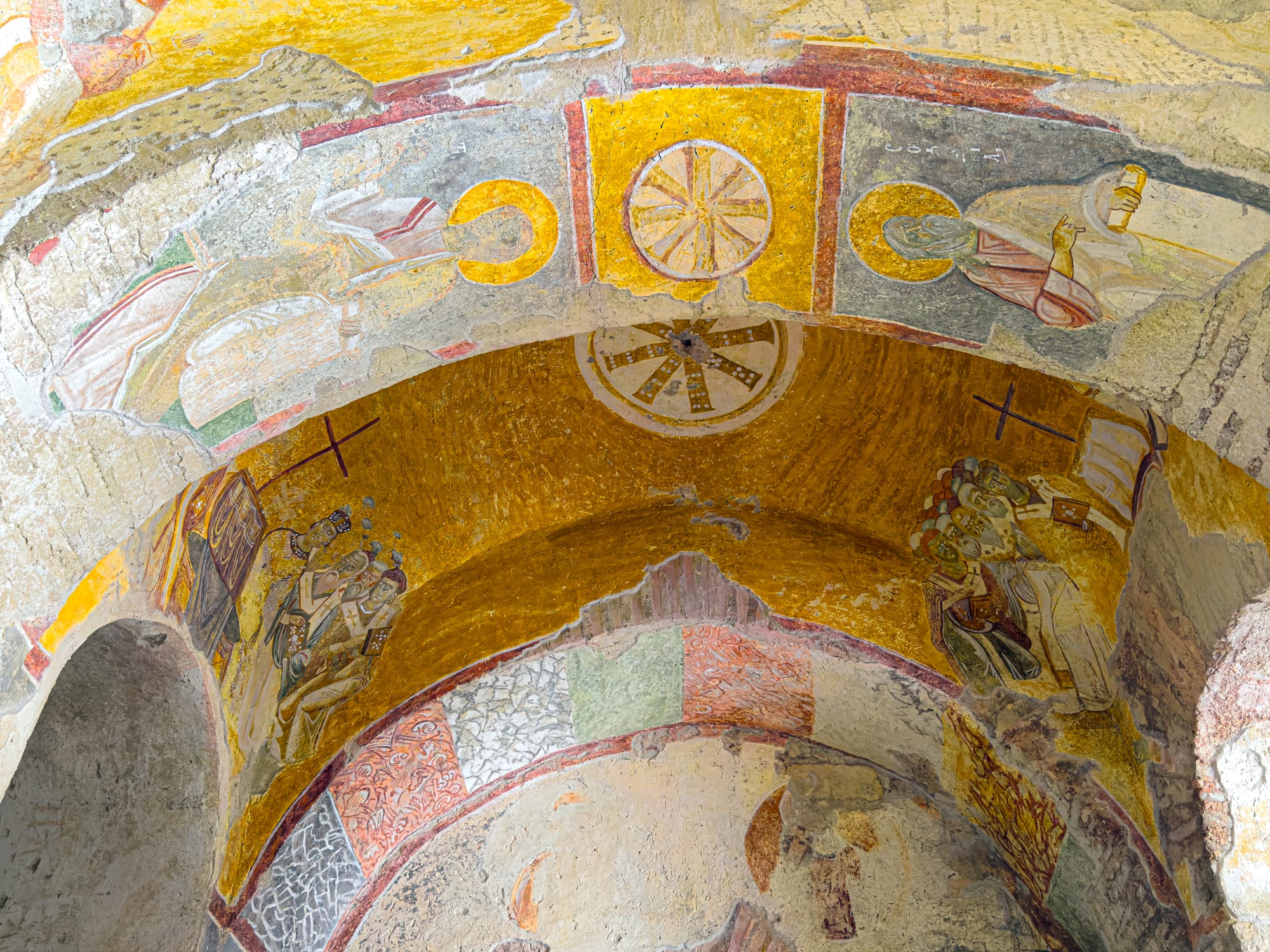 Intricate frescoes with gold and red detailing on the domed ceiling of the Church of St. Nicholas in Demre, Turkey