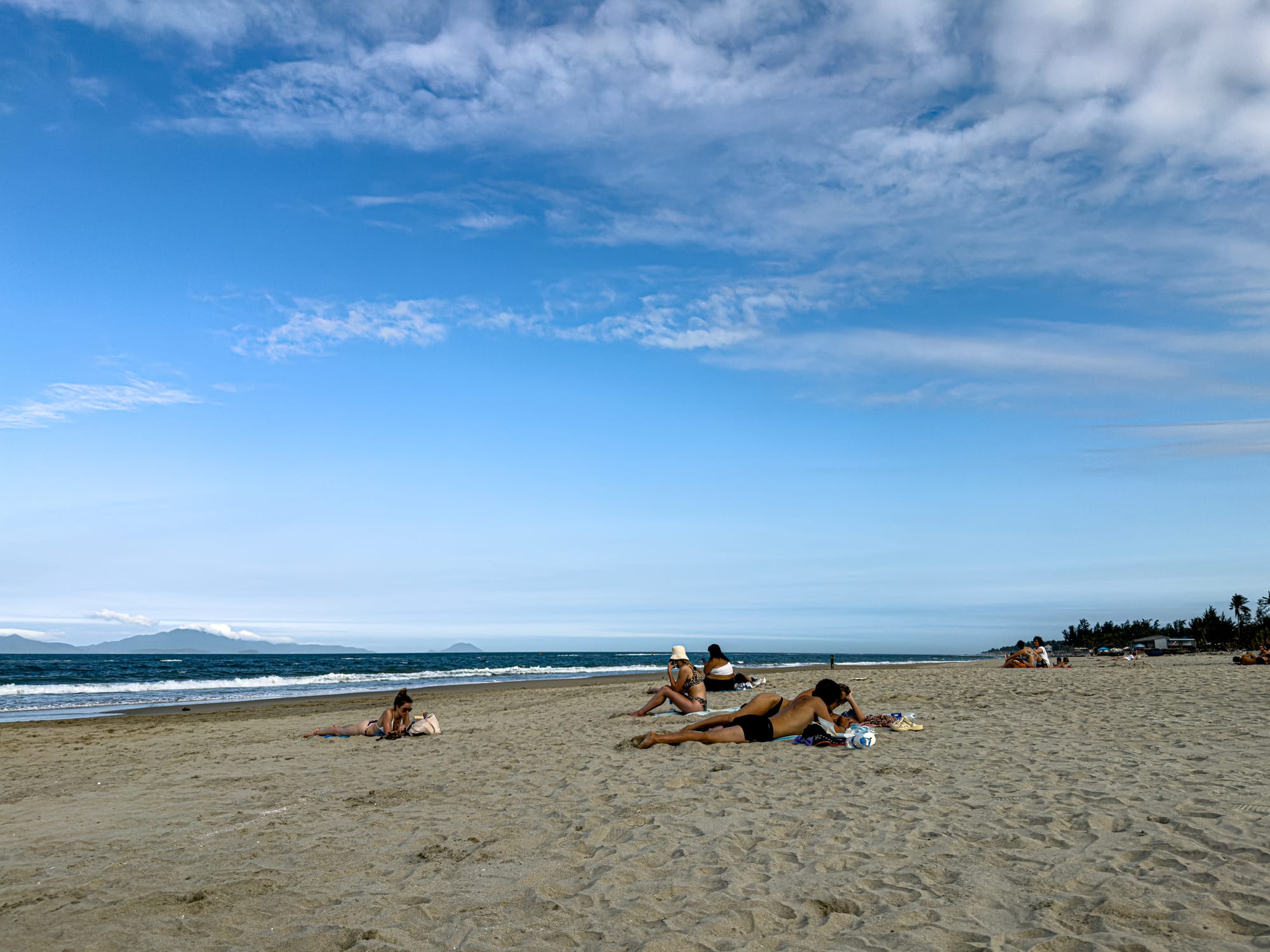 People relaxing on An Bàng in Hội An