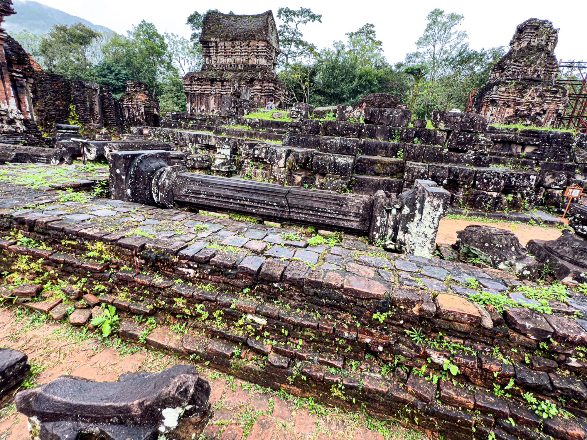 Collapsed stone columns and temple ruins at Mỹ Sơn Sanctuary Cham heritage site near Hội An, Vietnam