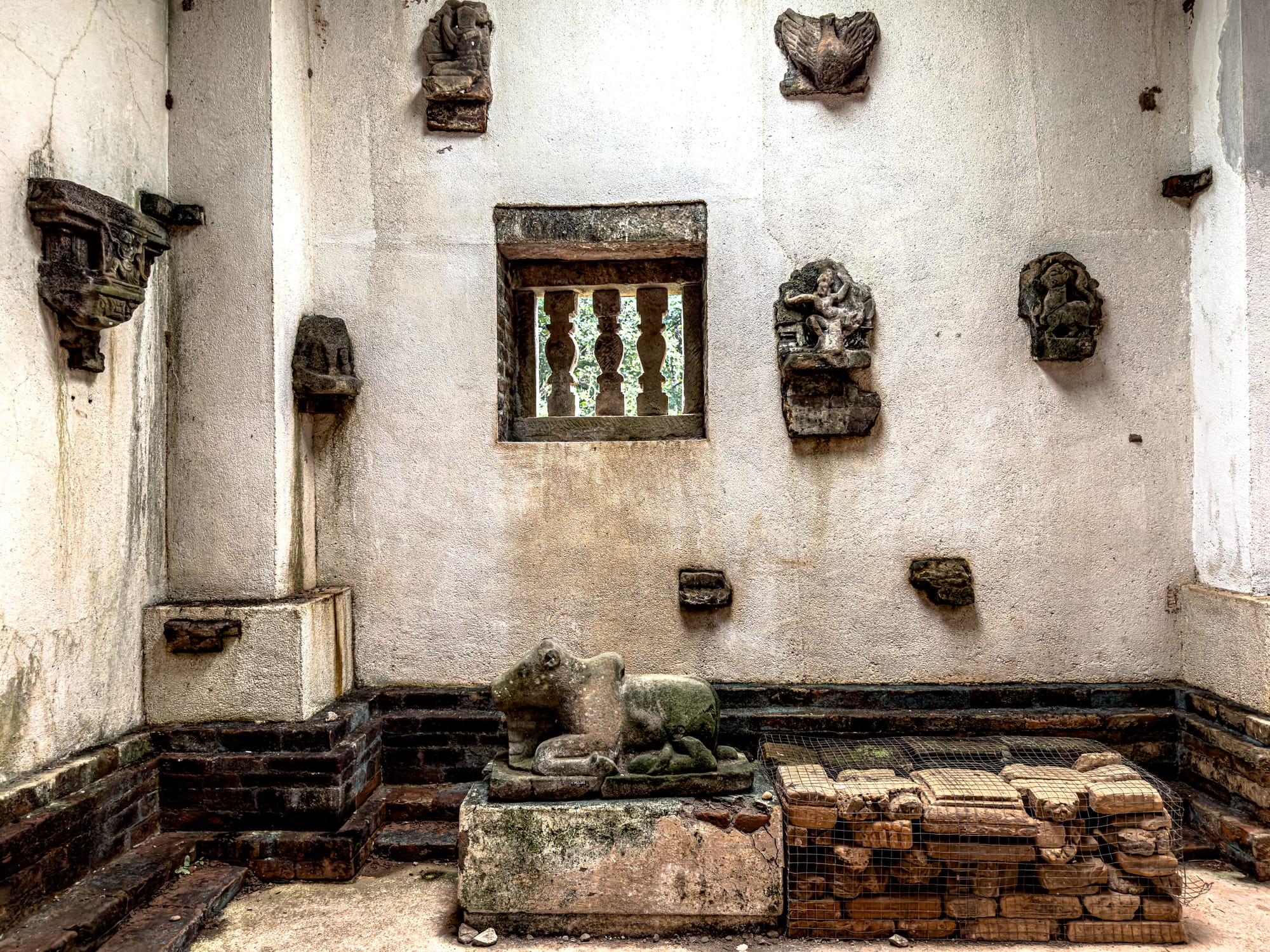 Ancient Cham stone sculptures displayed inside a preservation room at Mỹ Sơn Sanctuary UNESCO site in Vietnam
