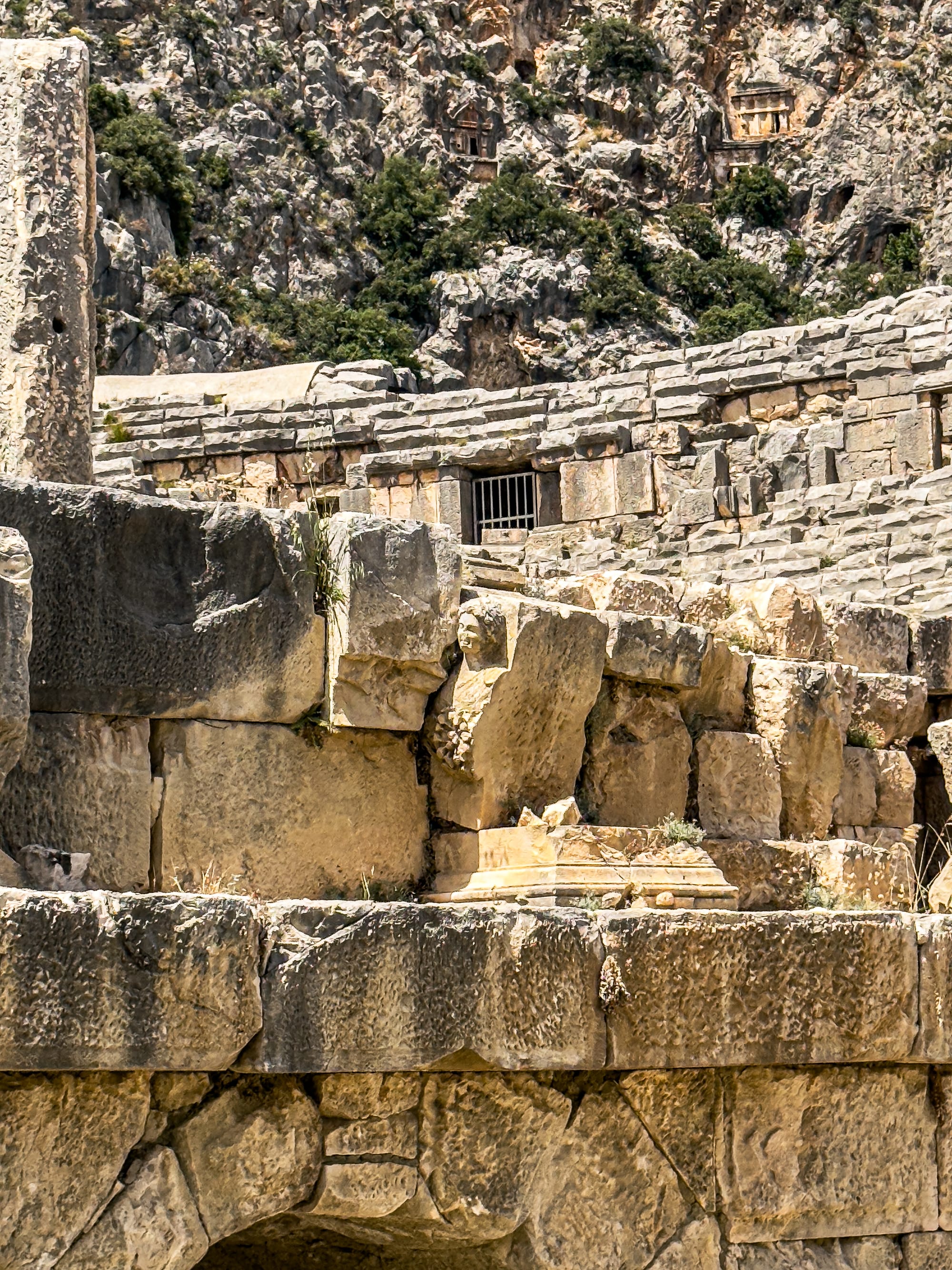 Stone bust partially embedded in the wall of the Roman theater at Myra, an ancient Lycian site in Turkey