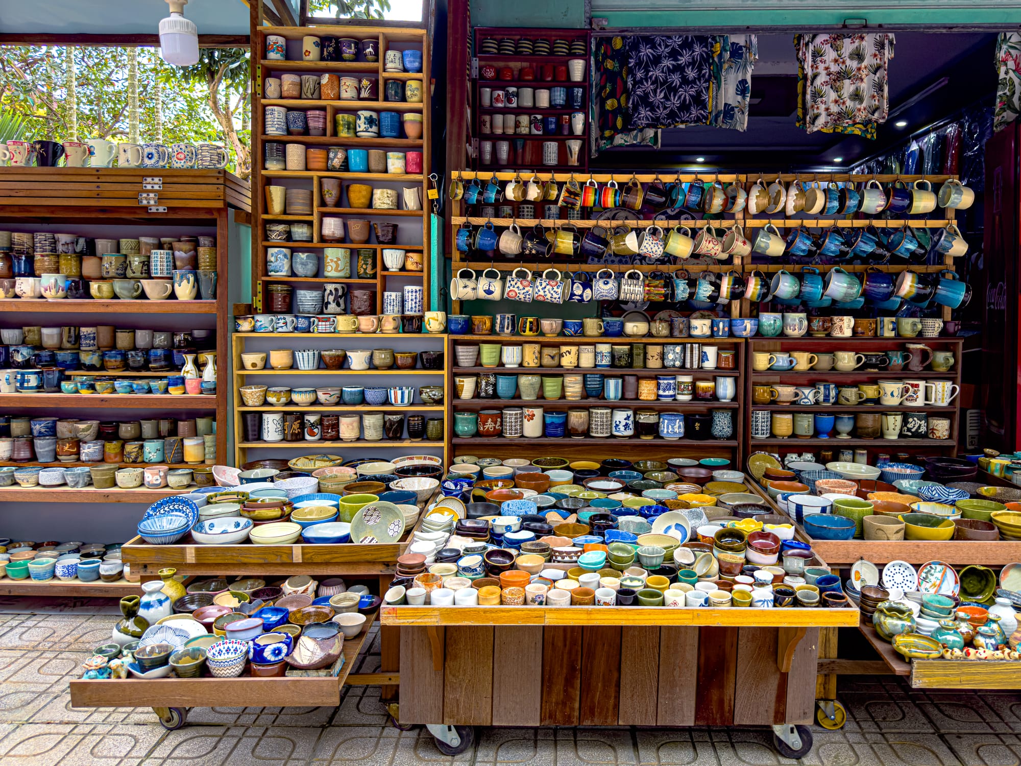 Colorful ceramic bowls, cups, and pottery on display at Thanh Hà Pottery Village Hội An, showcasing traditional Vietnamese handicrafts