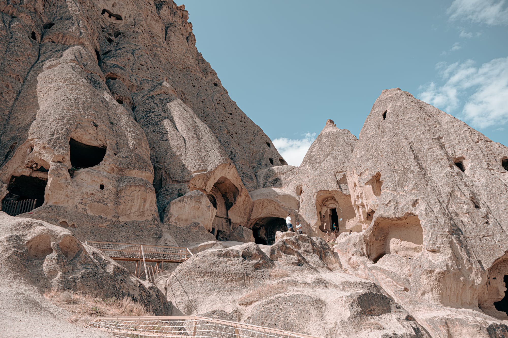 Rock-cut entrances and pathways carved into the cliffs at Selime Monastery in Cappadocia