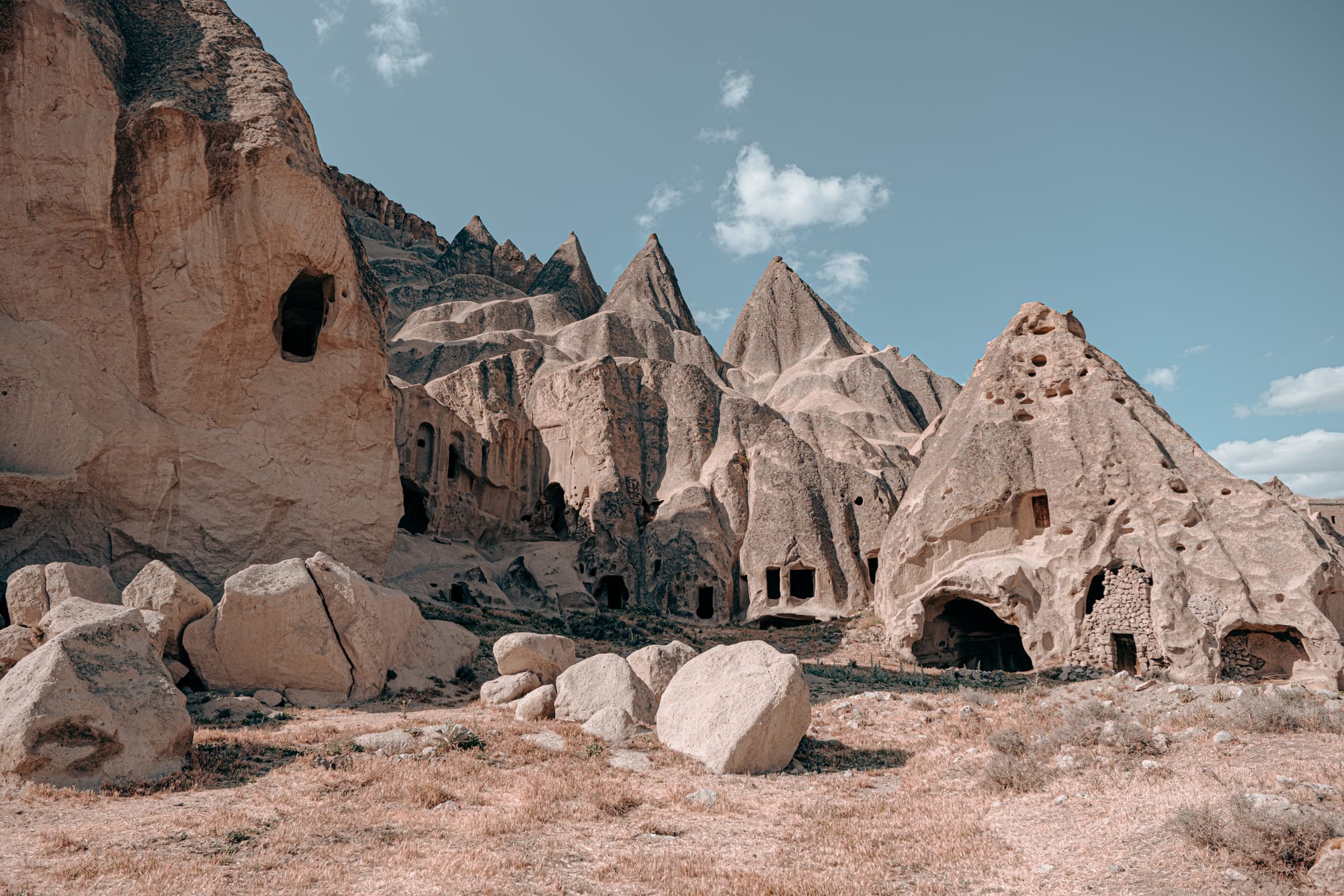 Panoramic view of conical rock formations and carved cave dwellings near Selime Monastery in Cappadocia