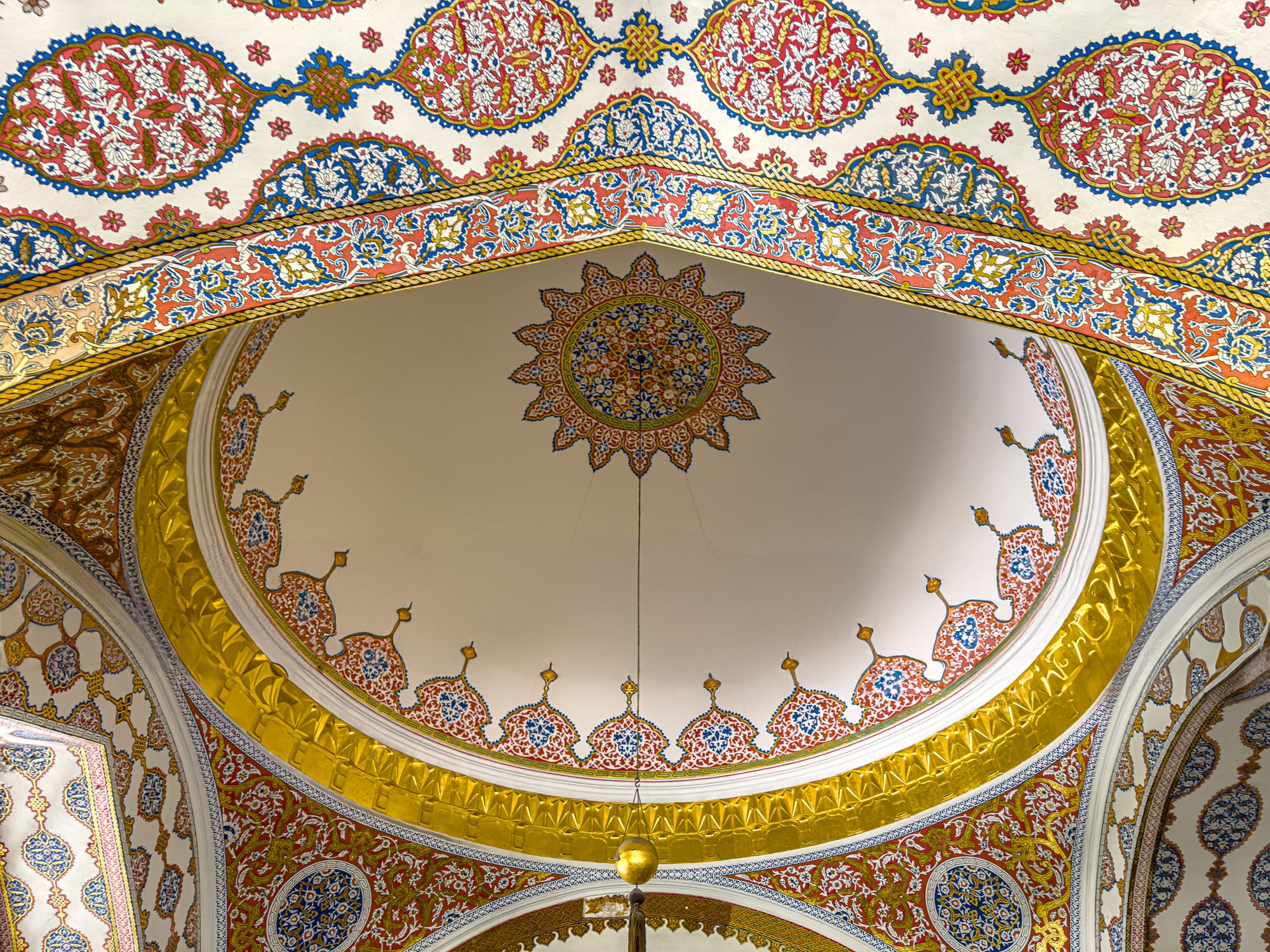 Intricately painted Ottoman dome with gold-leaf detailing and floral geometric motifs
