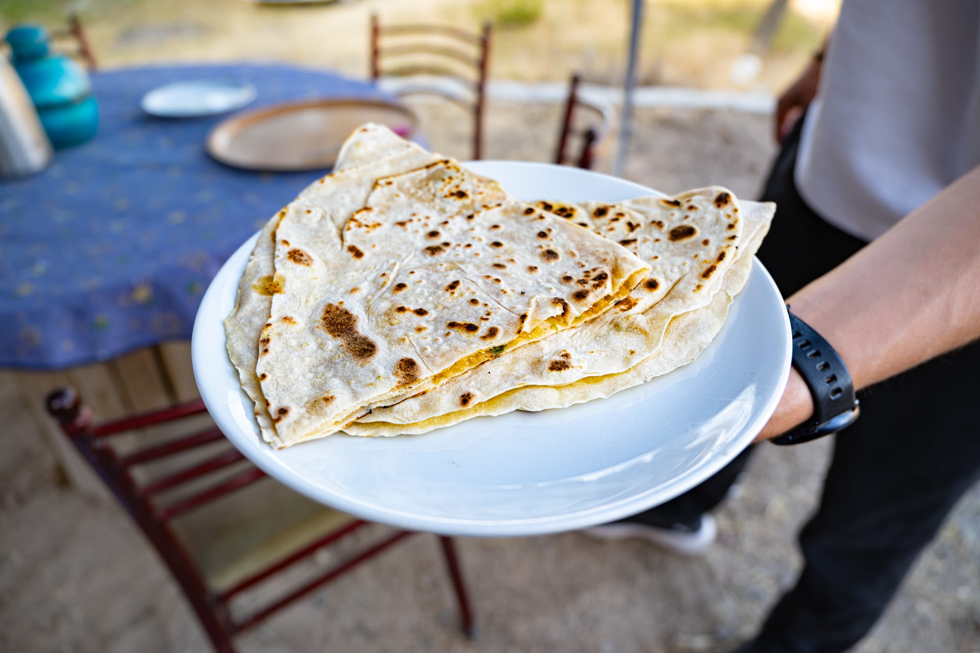 Freshly made gözleme filled with herby potato, served hot and ready to enjoy after a cooking session with local women in Cappadocia
