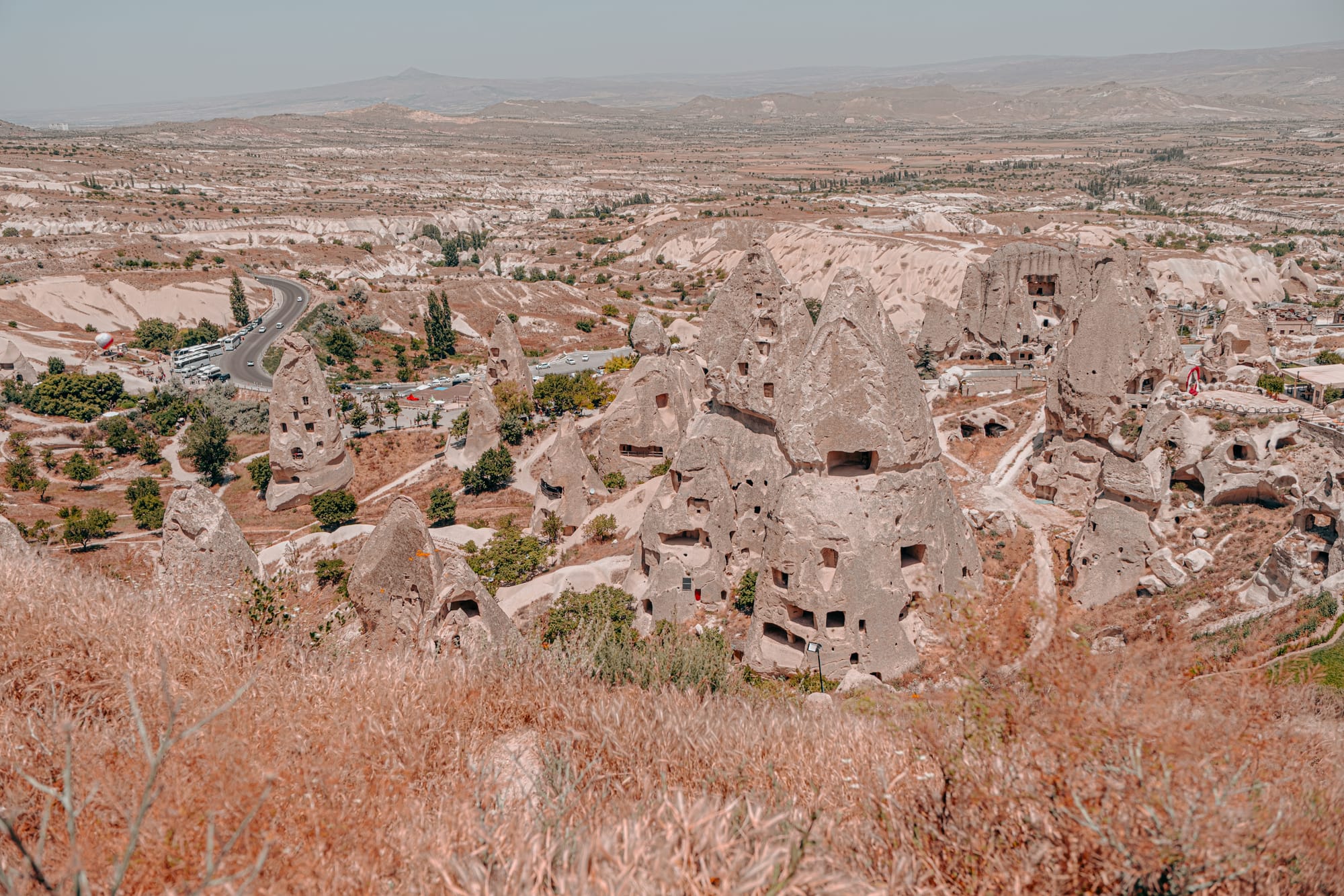 Uçhisar Castle Cappadocia surrounding fairy chimney formations with carved rock dwellings and panoramic valley views