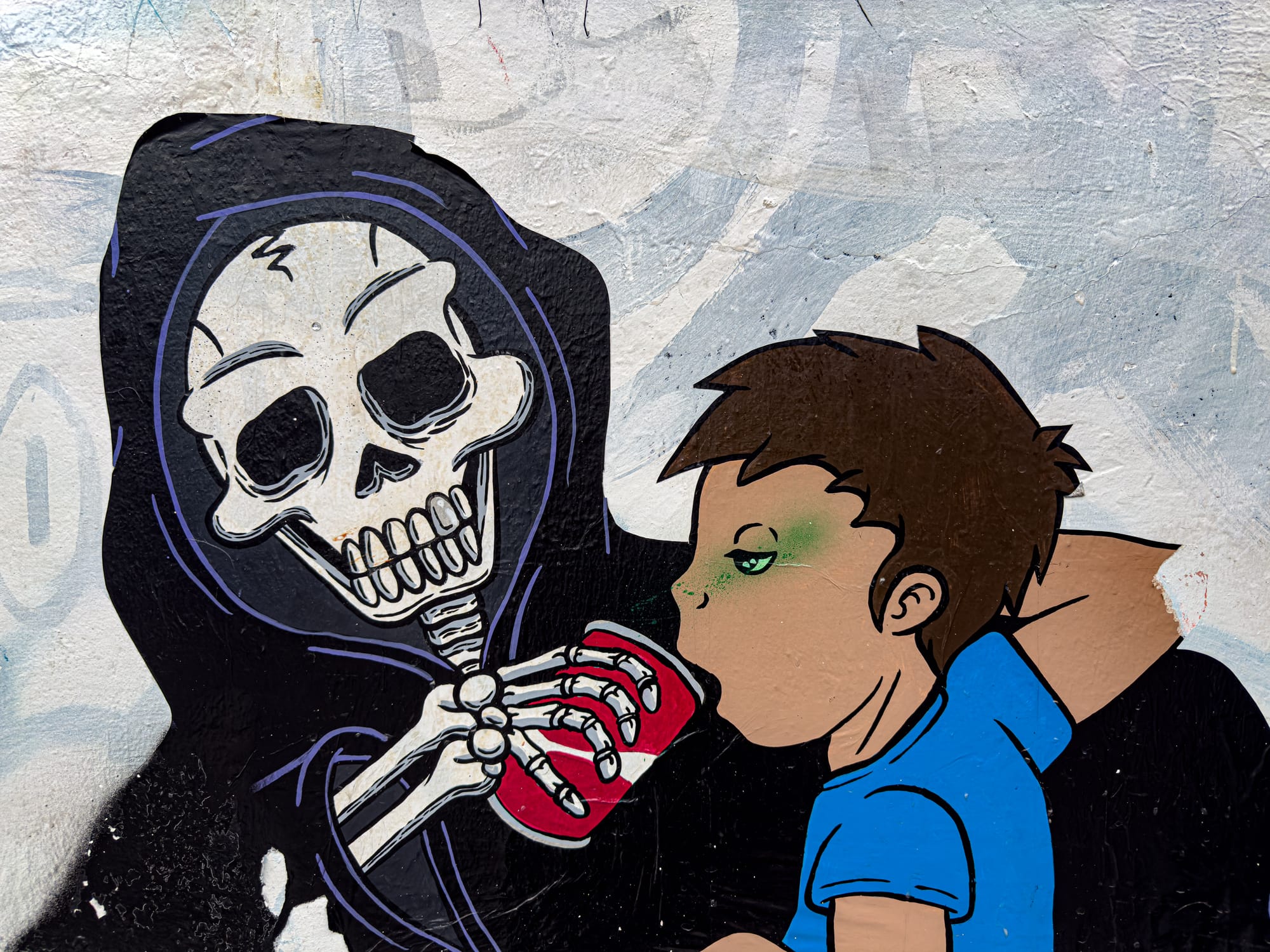 A mural in El Cerrillo, San Cristóbal de las Casas, showing a skeletal Grim Reaper offering a red soda can to a child, symbolizing the health and environmental dangers of sugary drinks and corporate influence in Chiapas