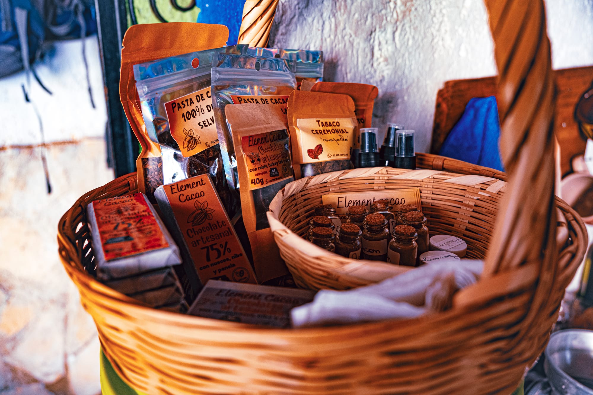 Element Cacao products including cacao paste, artisanal chocolate, and small ceremonial items displayed in a basket in San Cristóbal de las Casas